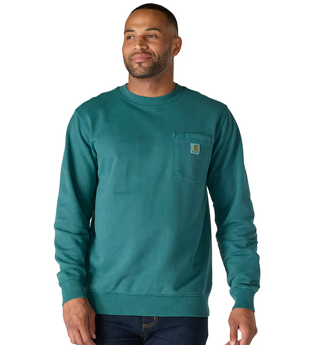 Man wearing a teal sweatshirt with a visible brand logo on a white background