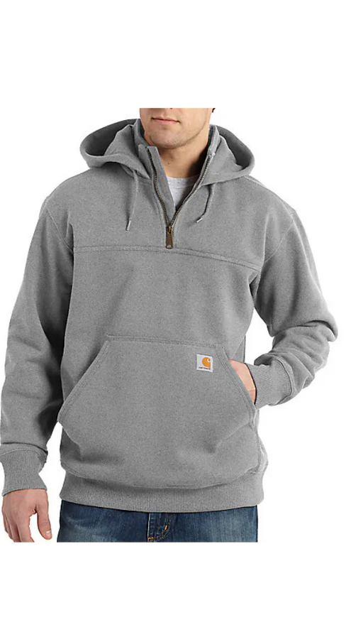 A man wearing a black Carhartt Rain Defender heavyweight quarter-zip hoodie with the brand logo visible on the chest.