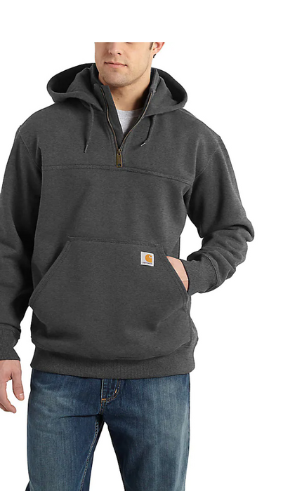 A man wearing a black Carhartt Rain Defender heavyweight quarter-zip hoodie with the brand logo visible on the chest.