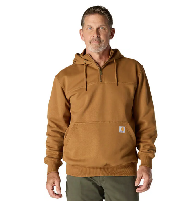Man wearing a brown hoodie with a visible brand logo on a white background