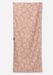 A rectangular beach towel with a repeating palm leaf pattern in cream on a dusty rose background, shown flat against a light gray studio background.