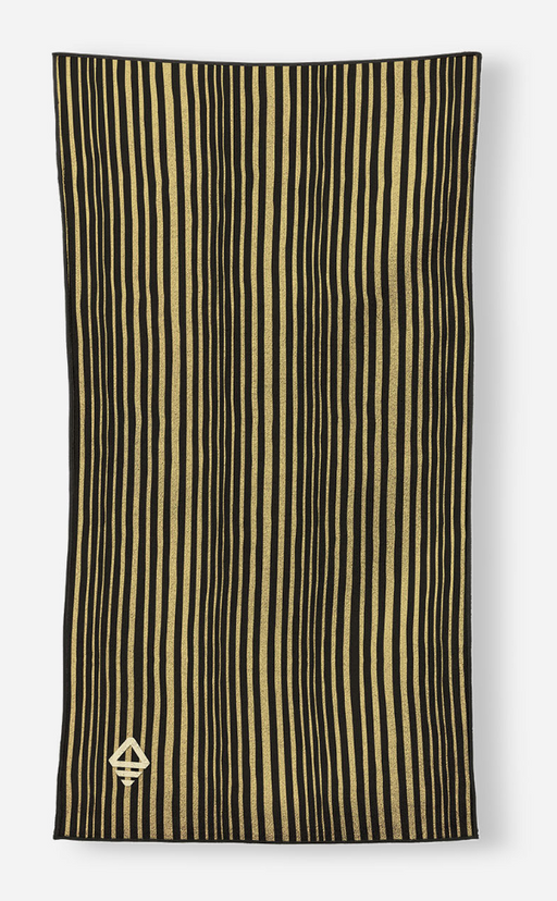A rectangular scarf with vertical black and gold stripes, featuring a small gold geometric emblem in the bottom-left corner, displayed against a light gray background.